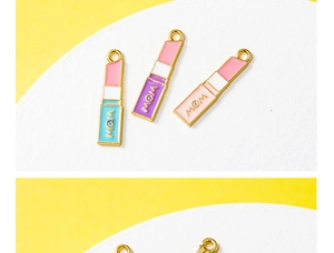 Detailed close-up of alloy lipstick charms with MOM and WOW engraving for DIY jewelry