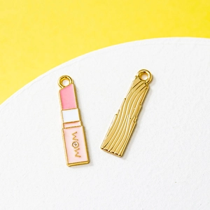 Lipstick charm pendant with WOW design in pink enamel and gold plated alloy metal