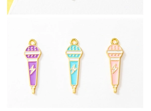 Three enamel microphone charms in purple, cyan, and pink with gold lightning detail