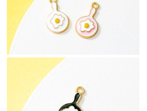 Detailed close-up of colorful alloy fried egg pan charms for DIY jewelry making