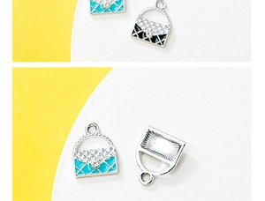Detailed macro view of quilted enamel handbag charms with crystal accents and silver base