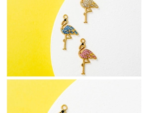Detailed macro view of gold flamingo pendants with blue, pink and white crystals