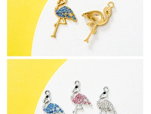 Macro view of flamingo pendant with colorful rhinestones and gold-plated finish