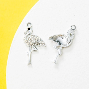 Sparkling flamingo pendant charms with silver metal plating and white rhinestones