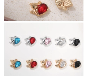Detailed view of colorful glass rhinestone heart pendants with gold and silver alloy plating