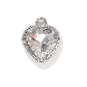 Polished silver heart pendant with clear faceted crystal and embossed metal frame on white