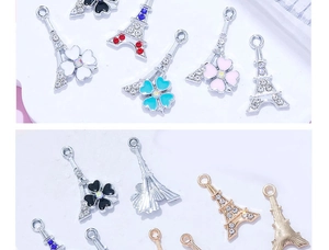 Detailweergave van Eiffeltoren hangers met gekleurde strass en bloemig emaille decor