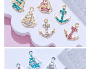 Detail of 14K gold plated nautical pendants with zircon crystals for DIY jewelry