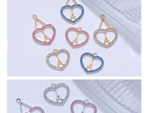 Detailed view of heart-shaped Eiffel Tower pendants with colorful sparkling zircons