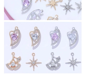 Detailed view of DIY alloy charms with heart wing and star designs for jewelry making
