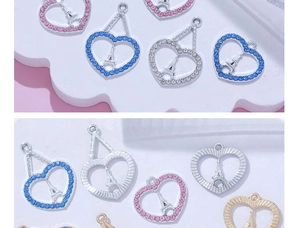 Detailed view of heart pendants with Eiffel Tower motif and colorful cubic zirconia