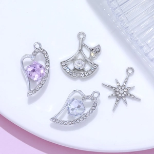 Luxe silver-plated heart, ginkgo and star charms set with sparkling crystals