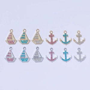 14K gold plated nautical charms featuring sailboat and anchor designs with colorful zircons