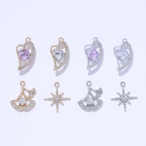 Elegant gold and silver heart, fan, and star jewelry pendants with crystal accents