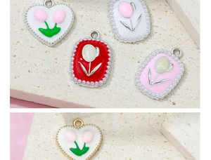 Macro detail of tulip flower charms with pearl borders in heart and rectangle shapes