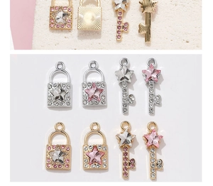 Detailed view of gold and silver DIY key and lock pendants with star-shaped crystals