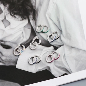 Macro shot of S925 sterling silver huggie earrings with colorful zircon stones