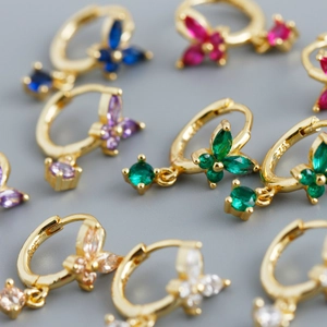 Detailed view of colorful butterfly hoop earrings in S925 sterling silver and gold finish