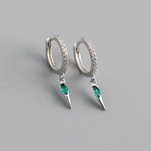 Macro shot of S925 silver hoop earrings with zircon pavé and green marquise stone drop