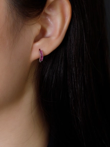 Close-up of S925 sterling silver earrings with rectangular pink zircon stones