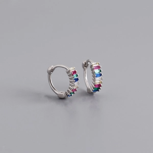Detail of S925 sterling silver huggie earrings with rainbow baguette-cut cubic zirconia