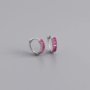 Detailed macro view of S925 sterling silver huggie earrings with red rectangular zircon
