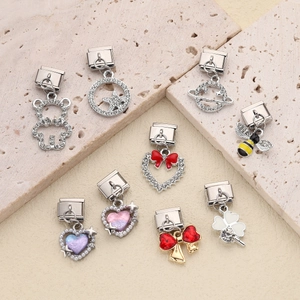 Italian charm collection with heart, bear, and bee motifs on stainless steel bases