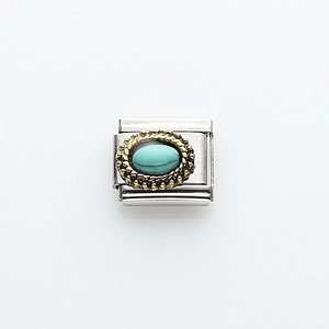 Detail of Italian modular link charm with oval turquoise stone and gold beaded edge