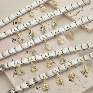 Bracciali charms italiani in acciaio inox con ciondoli marini dorati e tartarughe