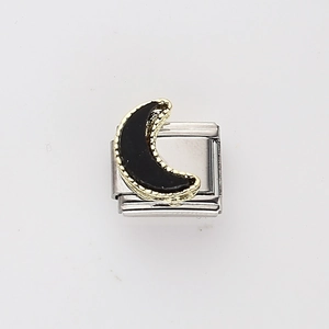 Macro shot of Italian charm link featuring a black crescent moon with gold beaded trim