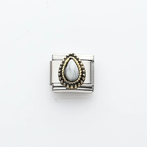 Italian charm link with drop-shaped white turquoise and vintage gold grain border
