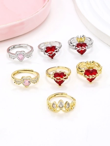 Detailed collection of heart and wing rings with ruby red and pink gemstones