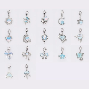 Blue opal charms with silver clasps featuring moon star and heart designs in array