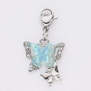 Blue butterfly charm with iridescent wings, clear crystals and silver lobster clasp