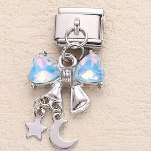 Macro detail of Italian charm with holographic hearts, star and moon in stainless steel