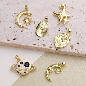 Vintage French gold plated charm pendants with moon star and portrait motifs for DIY jewelry