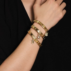 Three gold stainless steel Italian charm bracelets with sea turtle, starfish and conch charms
