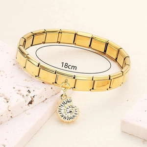Golden stainless steel modular link bracelet with a detailed sea snail shell pendant