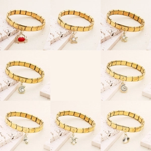Gold stainless steel Italian charm bracelet featuring various ocean animal pendants