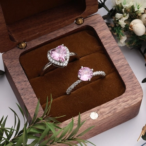 Pink heart-shaped zircon adjustable ring set in a vintage wooden jewelry box