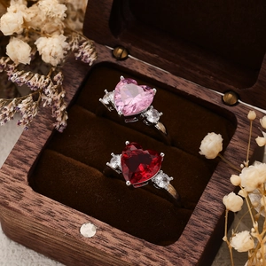 Elegant heart-shaped zircon rings with pink and red gemstones on silver-tone bands
