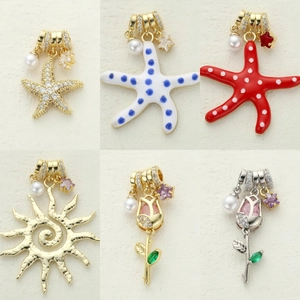 Detailed set of charms including starfish, sun, and tulip motifs with pearls and zircons