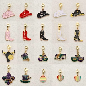 Detail of Western cowboy and Mardi Gras charms with colorful enamel and lobster clasps