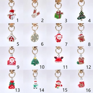 Set of 16 assorted Christmas alloy keychains with festive snowman and reindeer charms