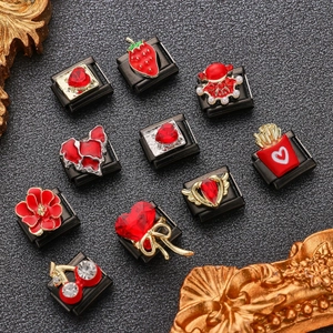 Italian style charm links set in black stainless steel with red enamel patterns
