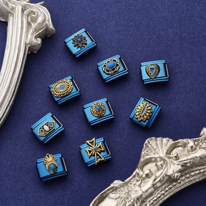 Vintage blue Italian modular stainless steel bracelet charms with golden embossed symbols