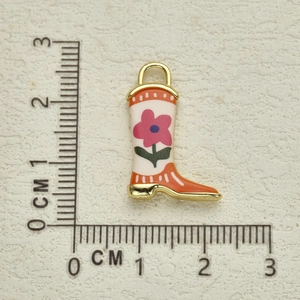 Detail of boot charm with floral pattern on scale showing 2.5cm height size
