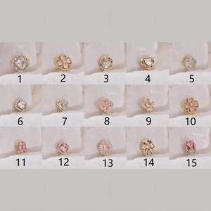 Selection of 15 gold flower and heart jewelry charms with pink zircon stones for DIY making