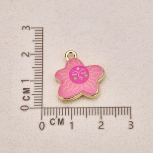 Pink star-shaped hand-painted pendant with scale ruler showing 2.3cm height and 2.1cm width