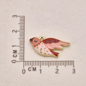 Macro view of hand-painted bird pendant with dimensions showing enamel details and size